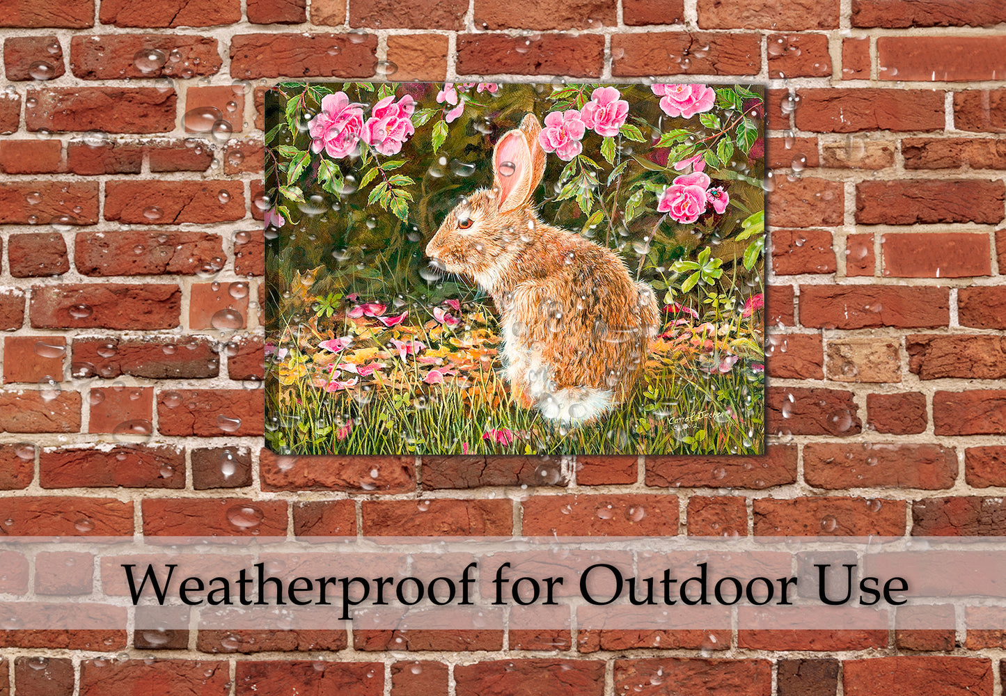 Image of a painting of a rabbit on a Bed of Roses on a canvas wrap hanging on the brick wall on a patio