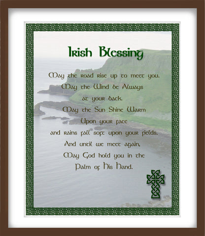 Irish blessing text with a scenic background and Celtic cross design on a framed print.