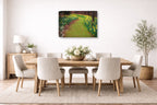 Canvas Wrap hanging in a dining room with a wooden table and chairs, a landscape painting on the wall, and decorative elements.