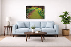 Living room with light blue sofa, wooden coffee table, and decorative painting on the wall.