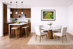 Espresso framed Wall art hanging in a modern kitchen and dining area with wooden floors and white walls.