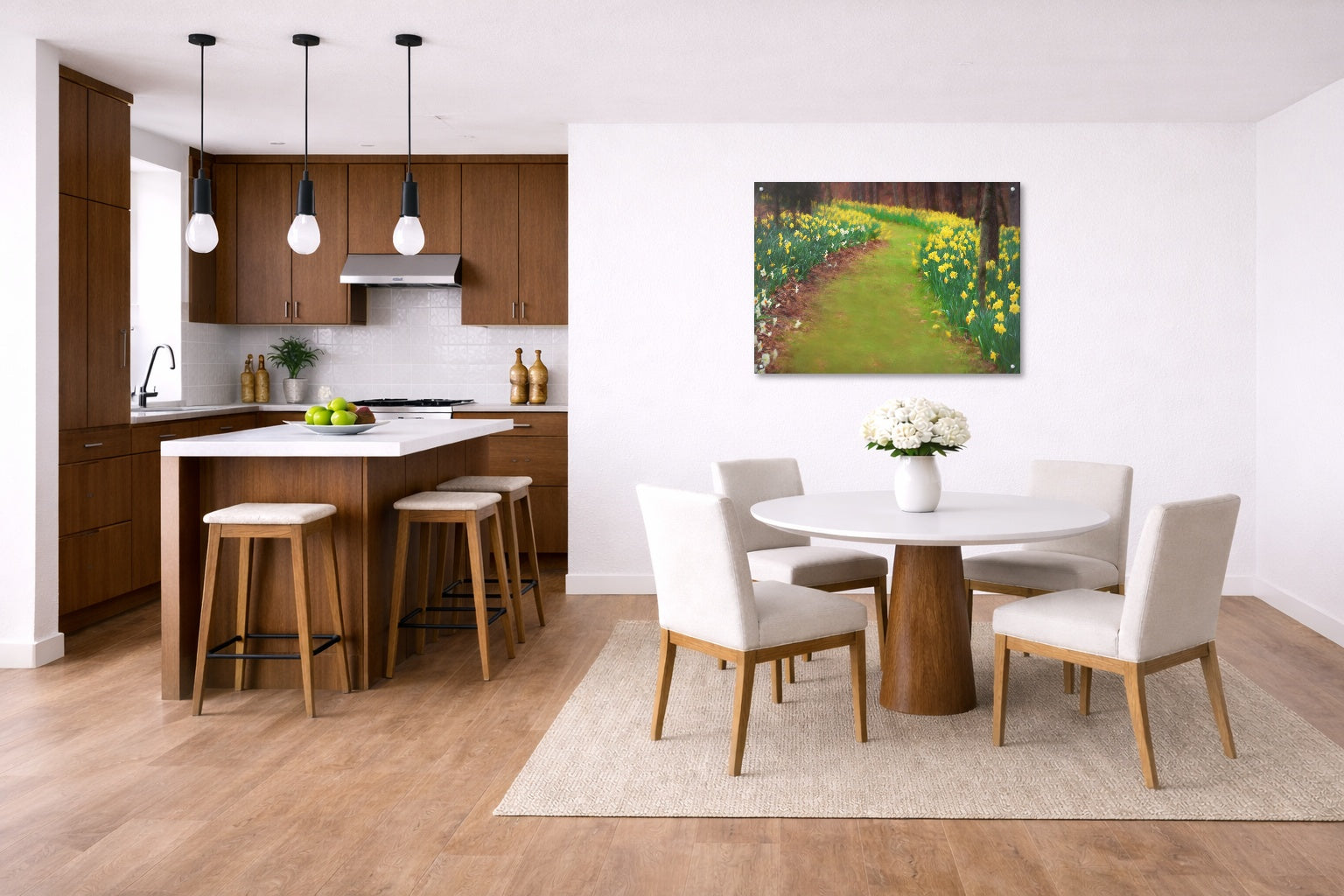 Modern kitchen and dining area with wooden floor, white walls, and a metal painting of a garden.