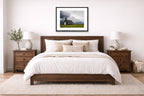 Black Church - Iceland printed on fine art paper, framed on a black frame and matted and hung on a wall on an bedroom wall.