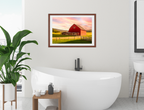 Painting of a Red Barn standing on a Field.  Printed on Fine Art Paper - Matted and Brown Frame. Hanging on Bathroom Wall
