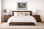 Majestic sandhill crane standing in Grass printed on fine art paper, framed on a black frame and matted and hung on a wall on an bedroom wall.