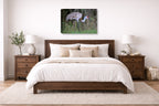 Majestic sandhill crane standing in Grass printed on canvas wall art displayed on a wall above a bed.