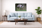 Majestic sandhill crane standing in Grass printed on canvas wall art displayed above a couch in a living room
