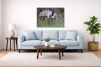 Majestic sandhill crane standing in Grass printed on aluminum metal with wall anchors. Hung on a living room wall.