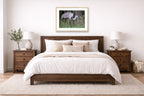 Majestic sandhill crane standing in Grass printed on fine art paper, framed in a oak frame and matted. Hung on a bedroom wall.