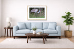 Majestic sandhill crane standing in Grass printed on fine art paper, framed on a oak frame and matted. Hung on a living room wall.