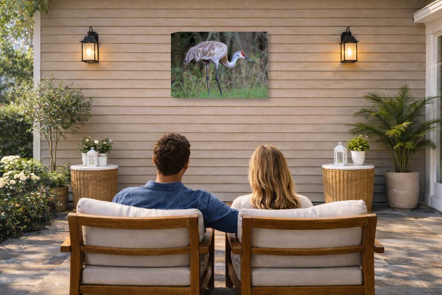 Majestic sandhill crane standing in Grass printed on water resistant canvas and mounted on a waterproof frame. Hung on a patio wall with couple.
