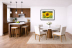 Sunflower in a Field printed on fine art paper, framed on a black frame and matted and hung on a wall on a dinette wall.