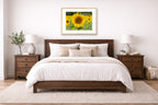 Sunflower in a Field printed on fine art paper, framed in a oak frame and matted. Hung on a bedroom wall.