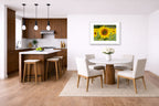 Sunflower in a Field printed on fine art paper, framed on a white frame and matted. Hung on a kitchen-dinette wall.