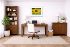 Sunflower in a Field printed on fine art paper, framed on a white frame and matted. Hung on a home office wall.