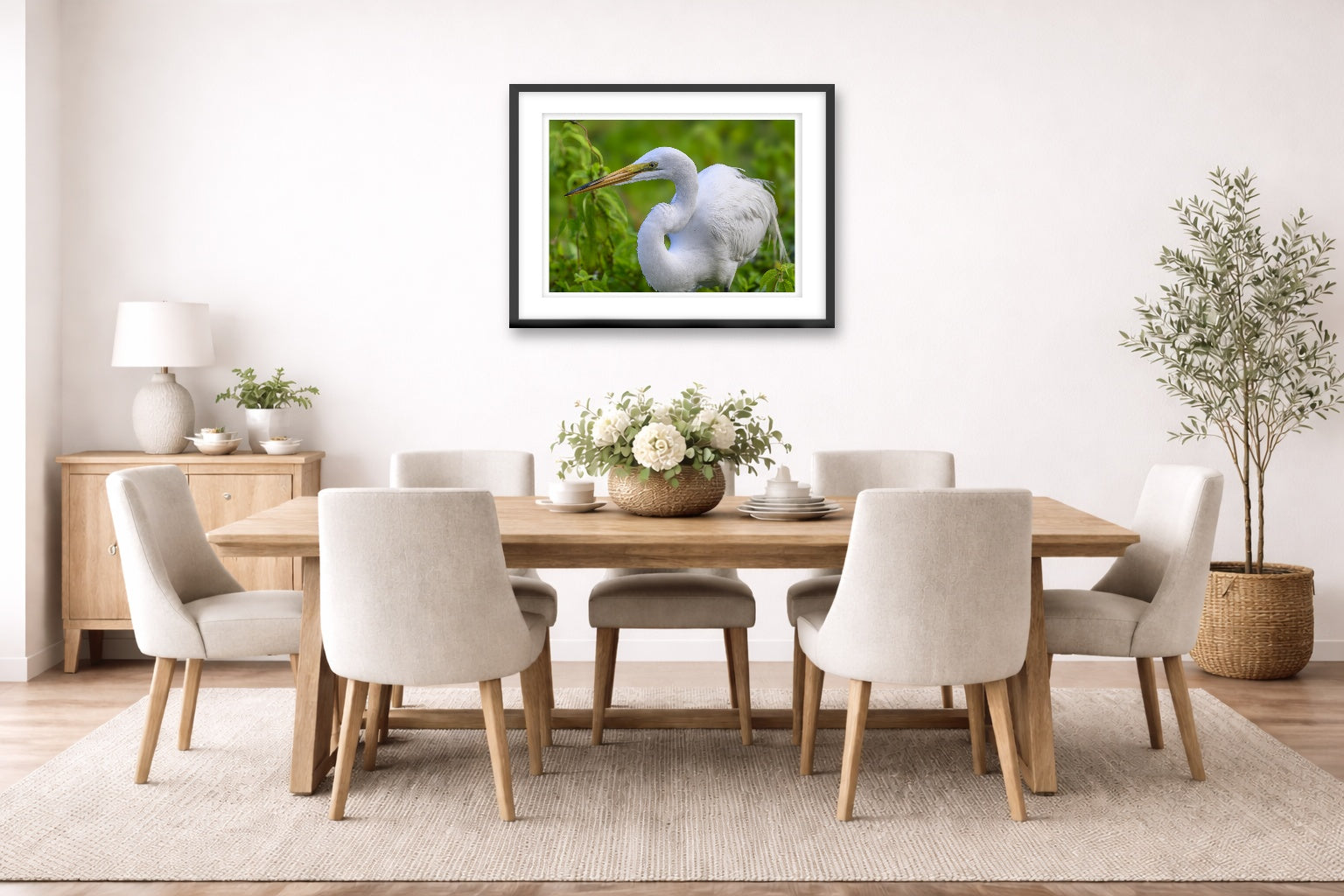 White Egret in Flight printed on fine art paper, framed on a black frame and matted and hung on a dining room wall.