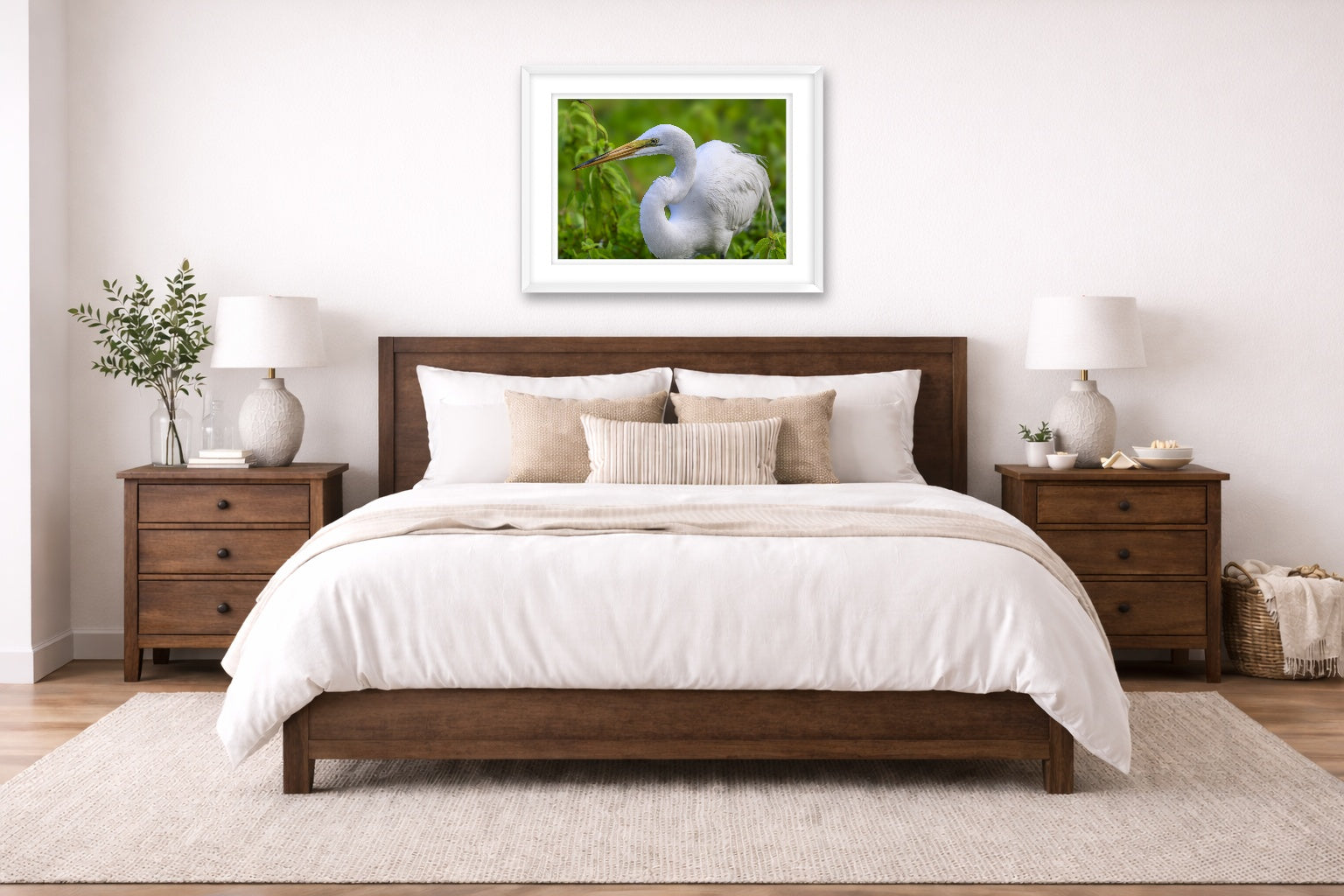 White Egret in Flight printed on fine art paper, framed on a white frame and matted. Hung on a bedroom room wall
