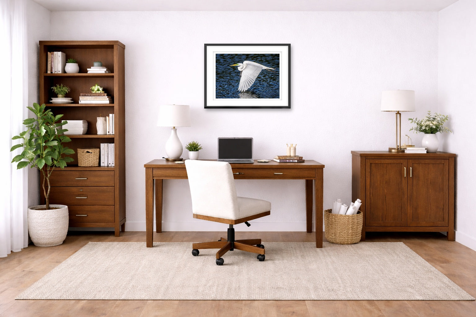 White Egret in Flight printed on fine art paper, framed on a black frame and matted and hung on a wall on an home office wall.