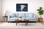 White Egret in Flight printed on canvas wall art displayed above a couch in a living room