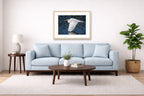 White Egret in Flight printed on fine art paper, framed on a oak frame and matted. Hung on a living room wall.