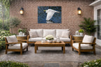White Egret in Flight printed on water resistant canvas and mounted on a waterproof frame. Hung on a patio wall.