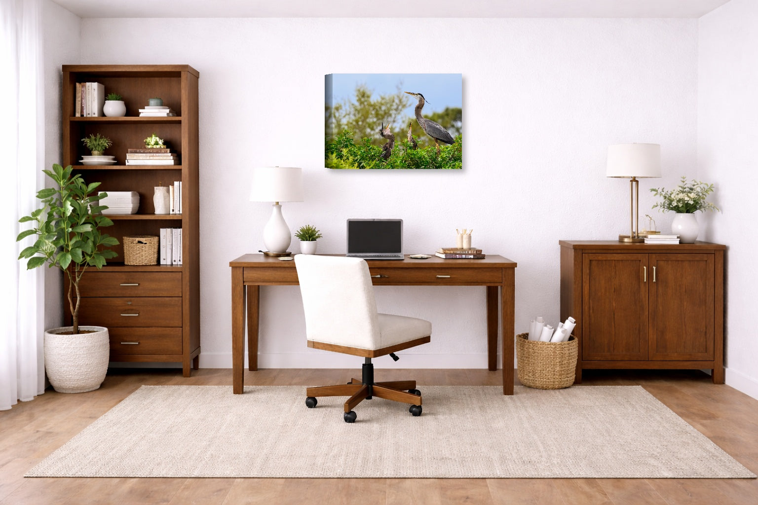 Blue Herons with Chicks printed on canvas wall art displayed on a wall in a a home office.
