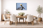Pelican Posing against a blue sky printed on canvas wall art displayed on a wall in the dinning room