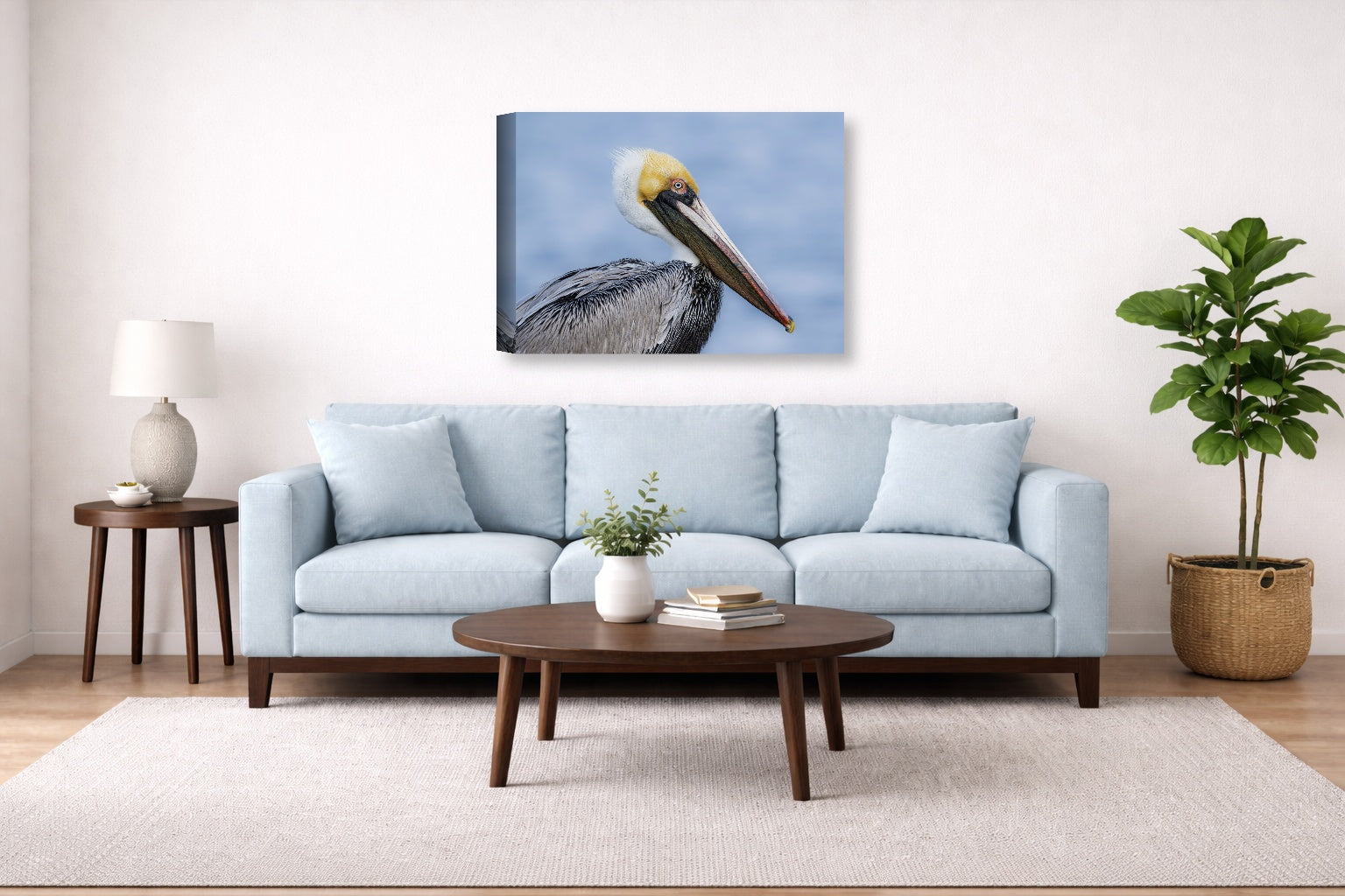 Pelican Posing against a blue sky printed on canvas wall art displayed above a couch in a living room