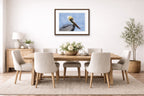 Pelican Posing against a blue sky printed on fine art paper, framed on a espresso frame and matted. Hung on a dinning room wall