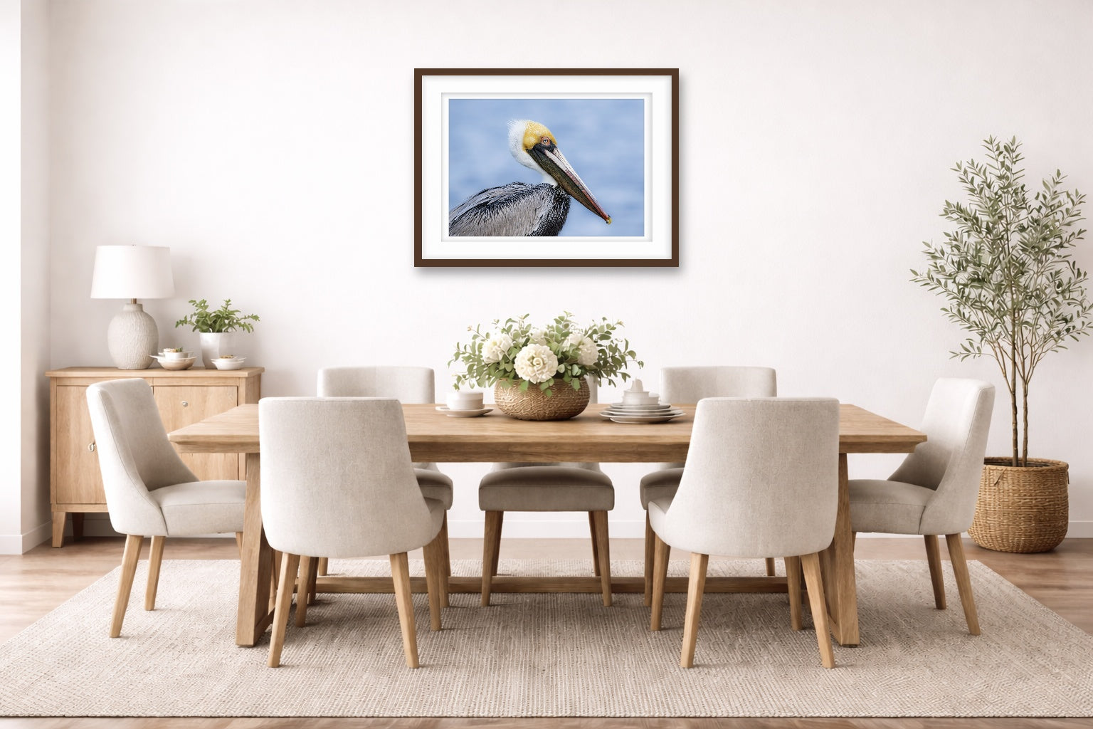 Pelican Posing against a blue sky printed on fine art paper, framed on a espresso frame and matted. Hung on a dinning room wall