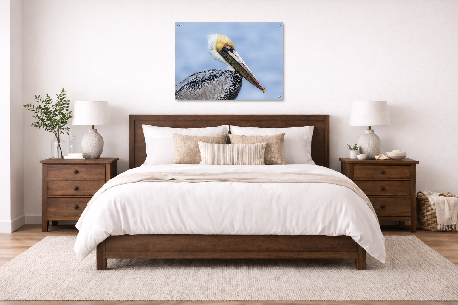 Pelican Posing against a blue sky printed on aluminum metal with wall anchors. Hung on a bedroom wall.
