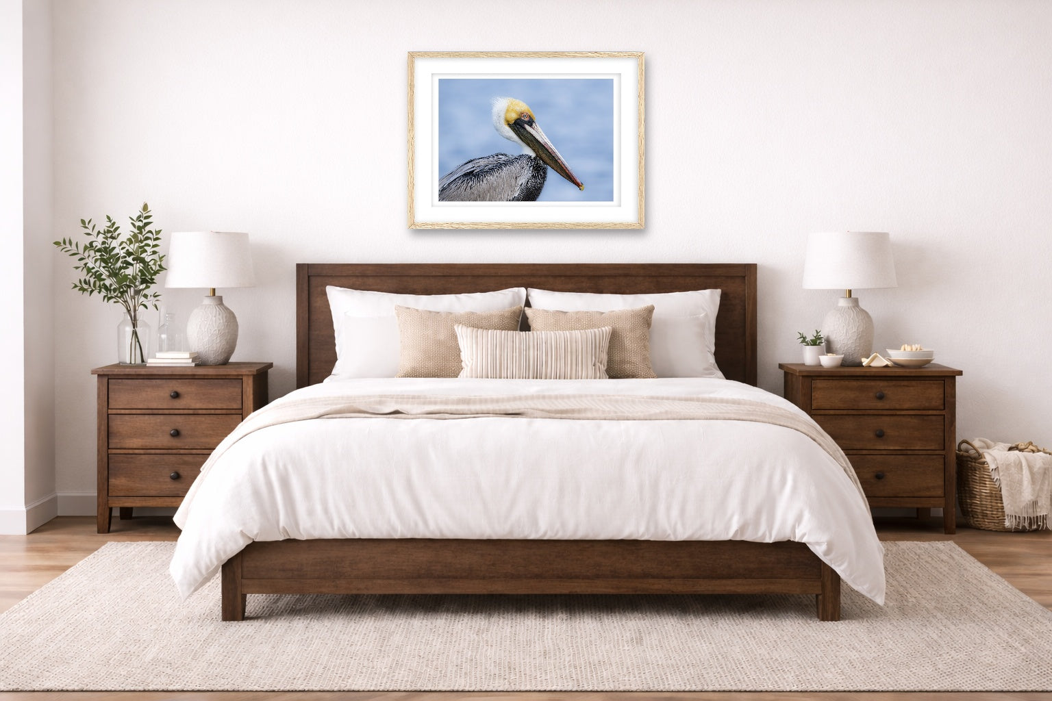 Pelican Posing against a blue sky printed on fine art paper, framed in a oak frame and matted. Hung on a bedroom wall.