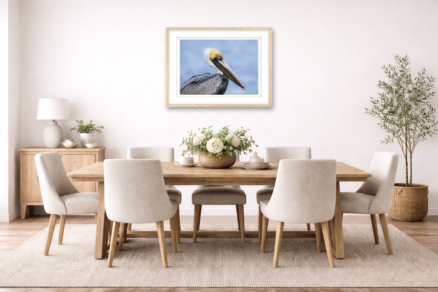Pelican Posing against a blue sky printed on fine art paper, framed on a oak frame and matted. Hung on a dining room wall.
