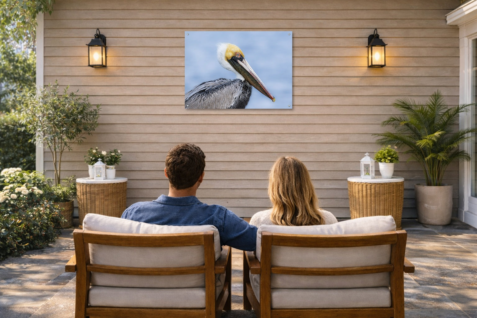 Pelican Posing against a blue sky printed on water resistant canvas and mounted on a waterproof frame. Hung on a patio wall with couple.