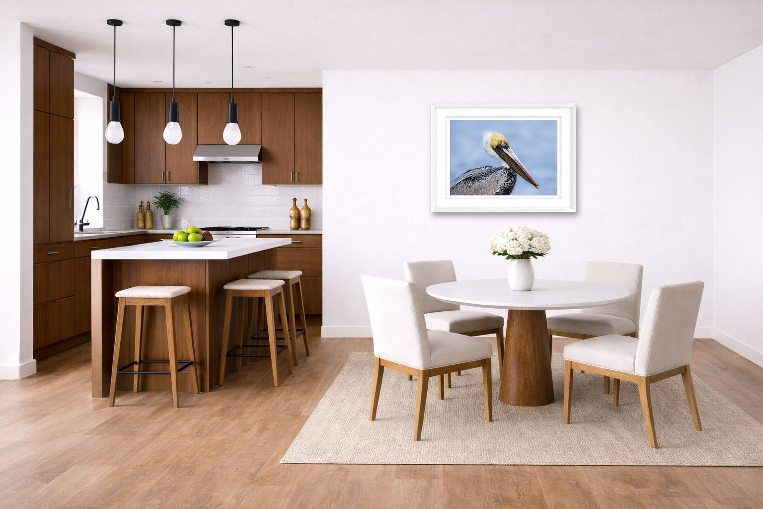 Pelican Posing against a blue sky printed on fine art paper, framed on a white frame and matted. Hung on a kitchen-dinette wall.