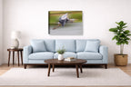 Blue Heron in Flight printed on canvas wall art displayed above a couch in a living room