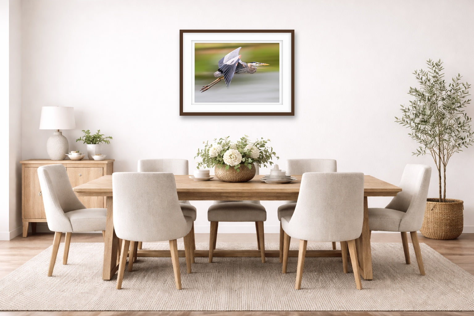 Blue Heron in Flight printed on fine art paper, framed on a espresso frame and matted. Hung on a dinning room wall