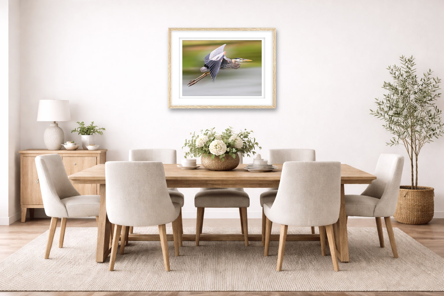 Blue Heron in Flight printed on fine art paper, framed on a oak frame and matted. Hung on a dining room wall.