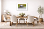 Blue Heron in Flight printed on fine art paper, framed on a white frame and matted. Hung on a dining room wall.