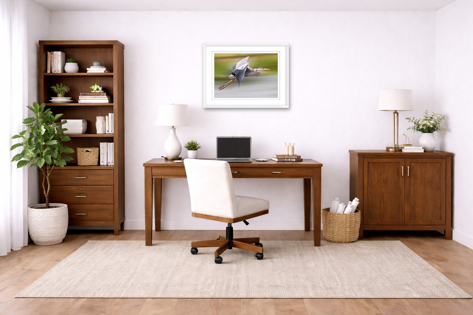 Blue Heron in Flight printed on fine art paper, framed on a white frame and matted. Hung on a home office wall.