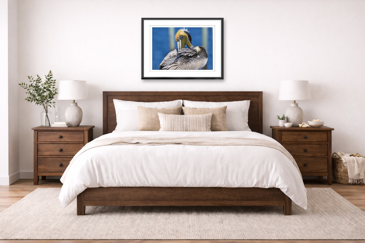Preening Pelican printed on fine art paper, framed on a black frame and matted and hung on a wall on an bedroom wall.