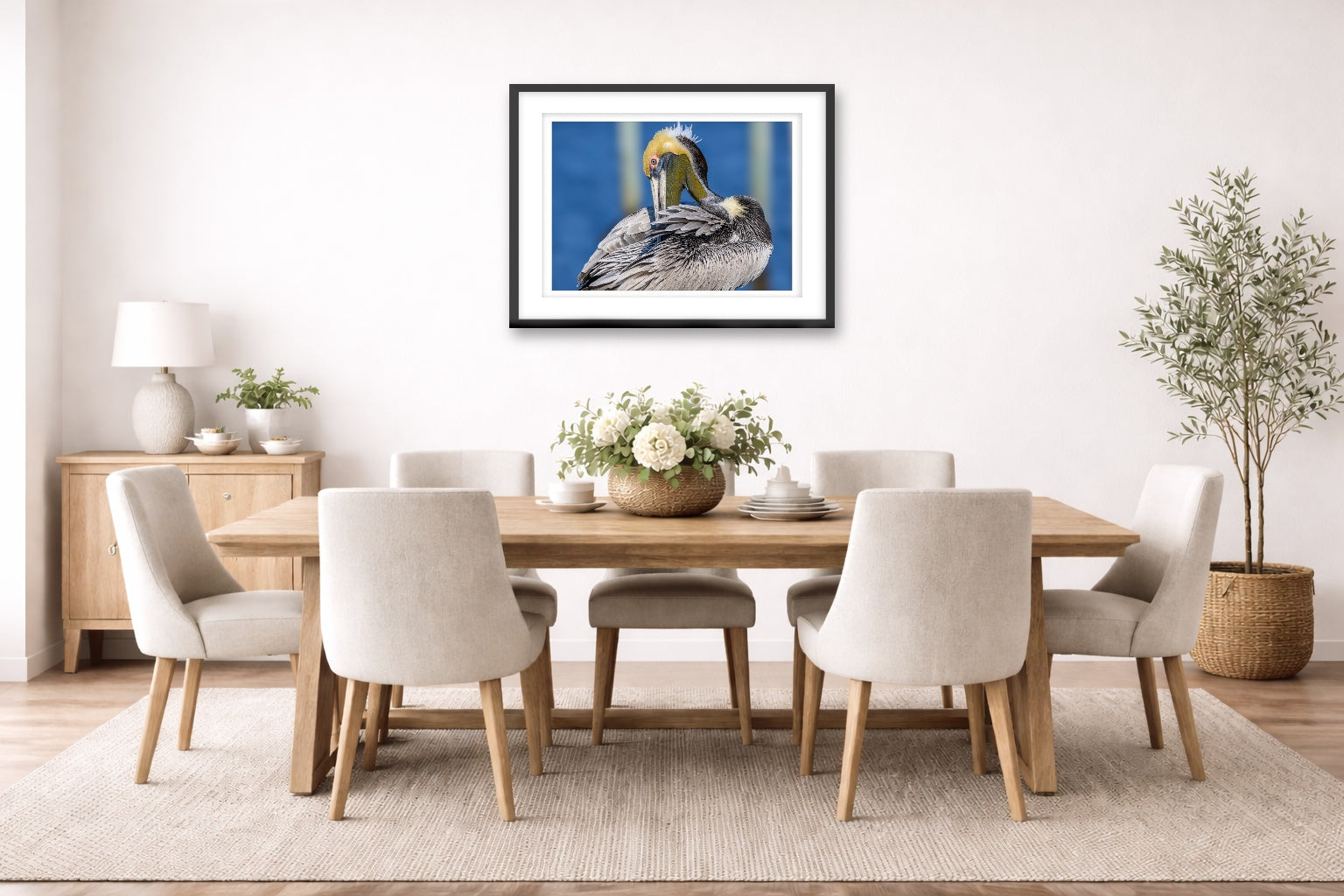 Preening Pelican printed on fine art paper, framed on a black frame and matted and hung on a dining room wall.