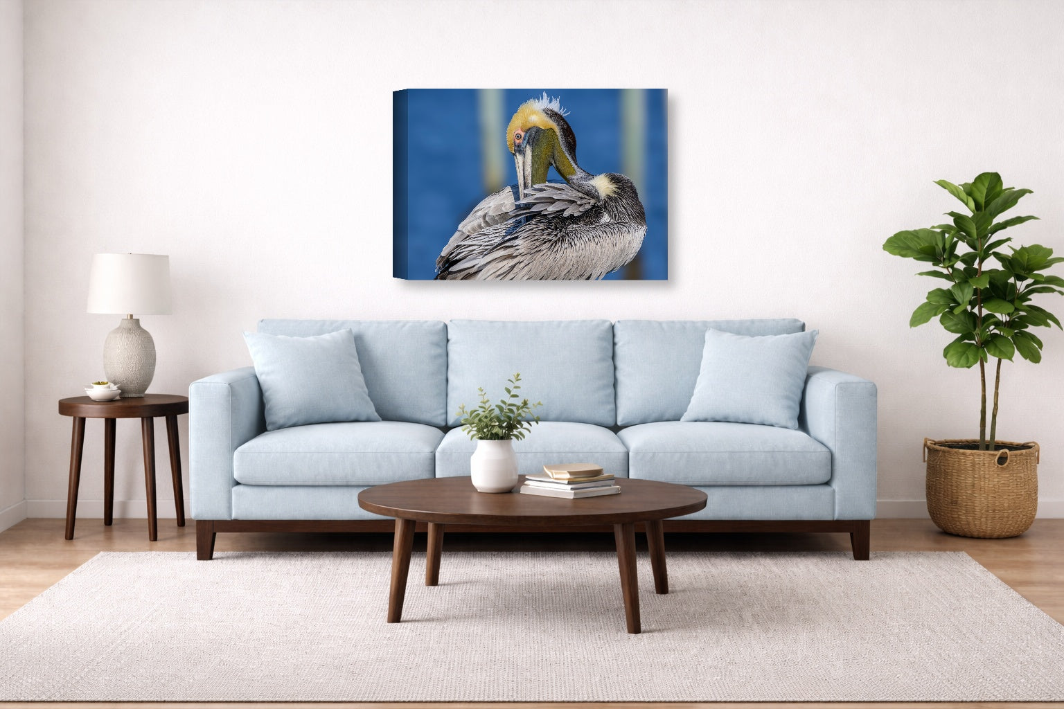 Preening Pelican printed on canvas wall art displayed above a couch in a living room