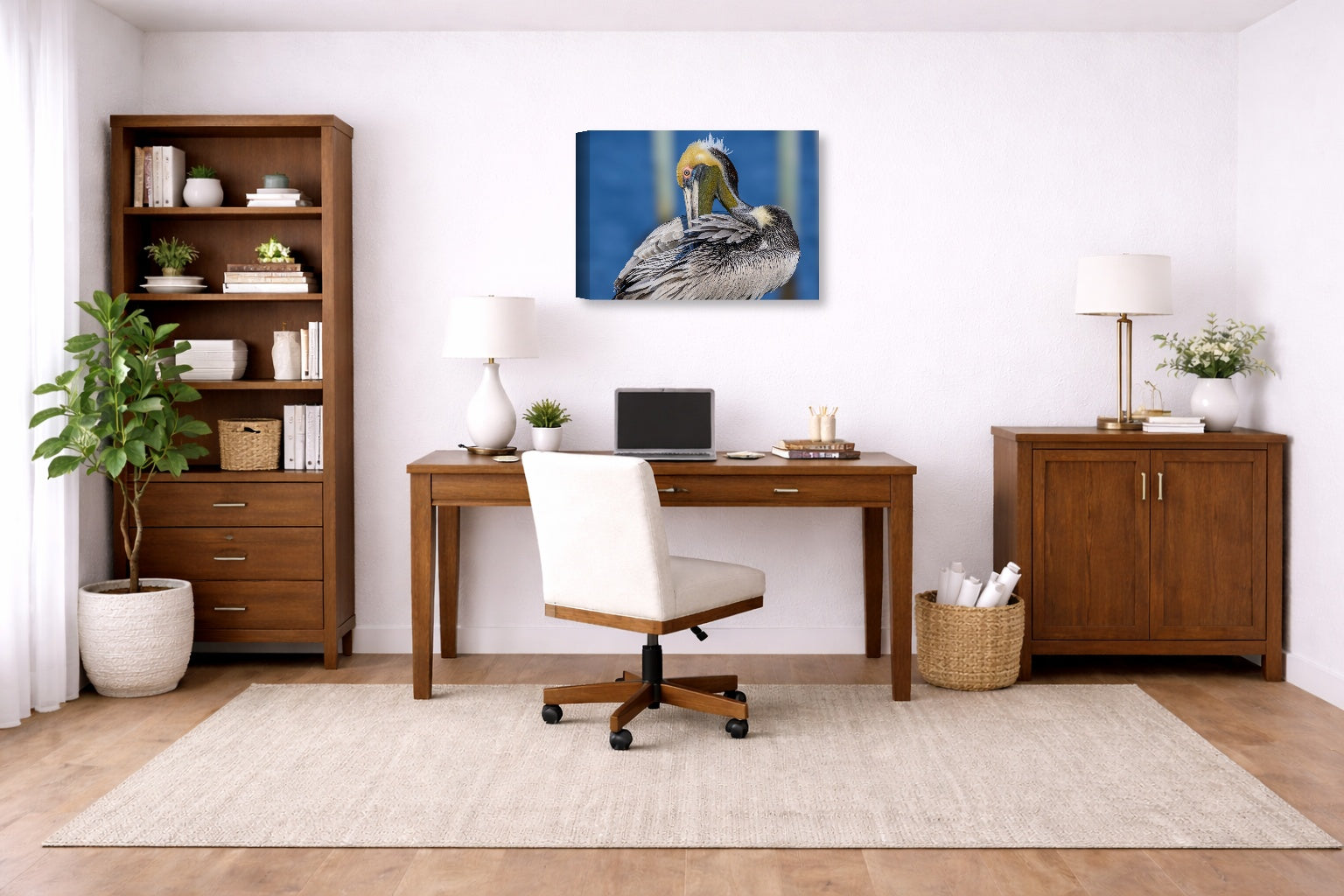 Preening Pelican printed on canvas wall art displayed on a wall in a a home office.