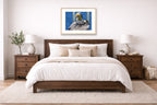 Preening Pelican printed on fine art paper, framed in a oak frame and matted. Hung on a bedroom wall.