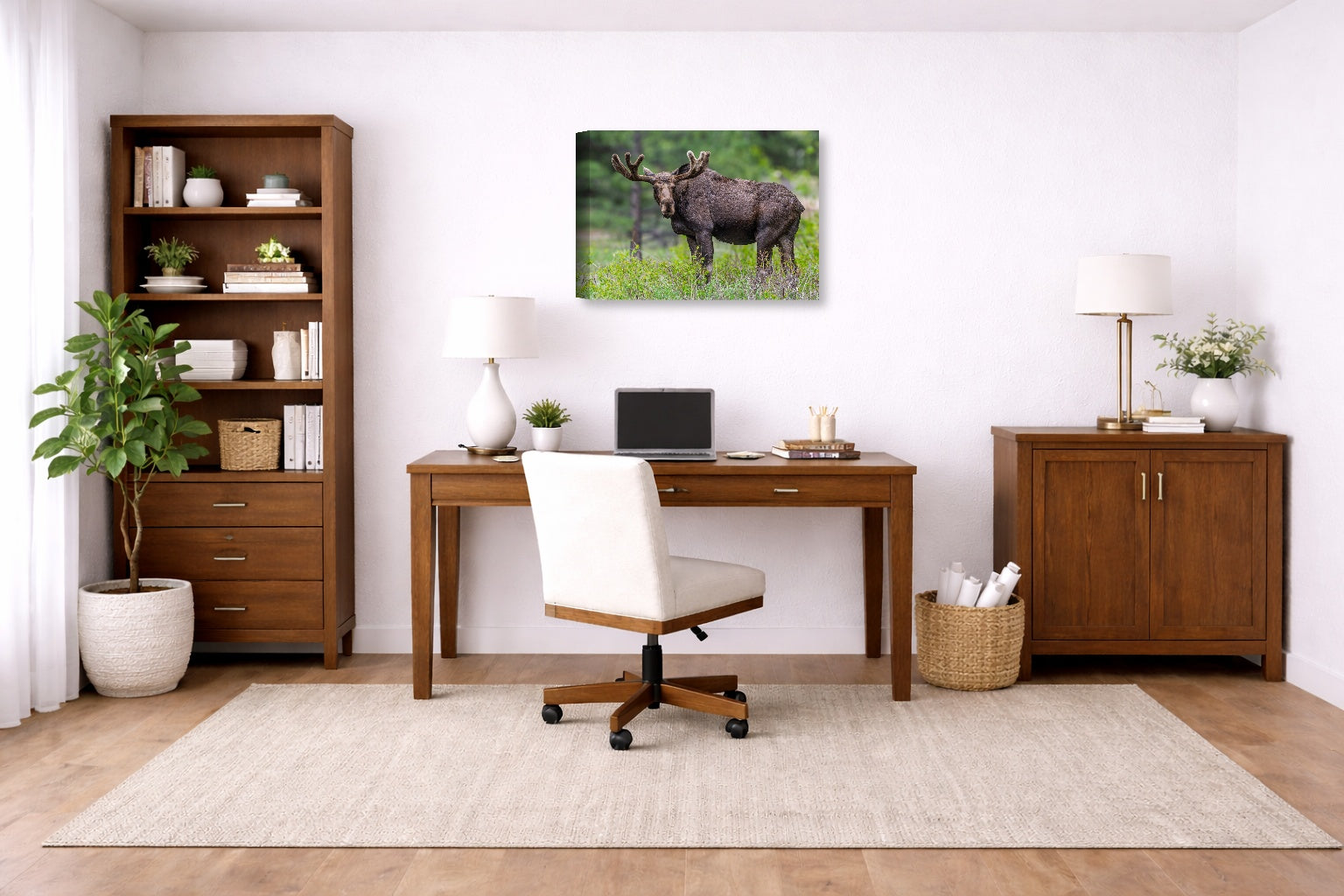 Moose in the Rockies printed on canvas wall art displayed on a wall in a a home office.