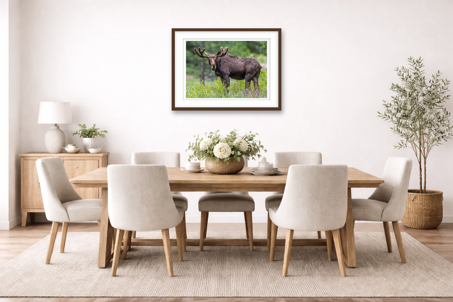Moose in the Rockies printed on fine art paper, framed on a espresso frame and matted. Hung on a dinning room wall