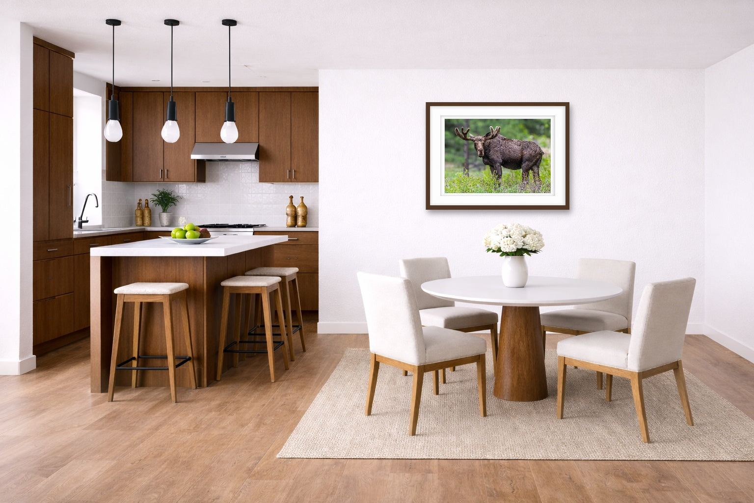 Moose in the Rockies printed on fine art paper, framed on a espresso frame and matted. Hung on a living kitchen-dinette wall.
