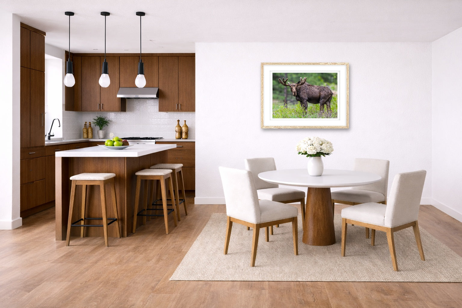Moose in the Rockies printed on fine art paper, framed on a oak frame and matted. Hung on a kitchen-dinette wall.