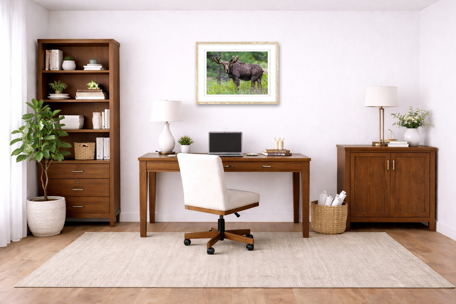 Moose in the Rockies printed on fine art paper, framed on a oak frame and matted. Hung on a home office wall.